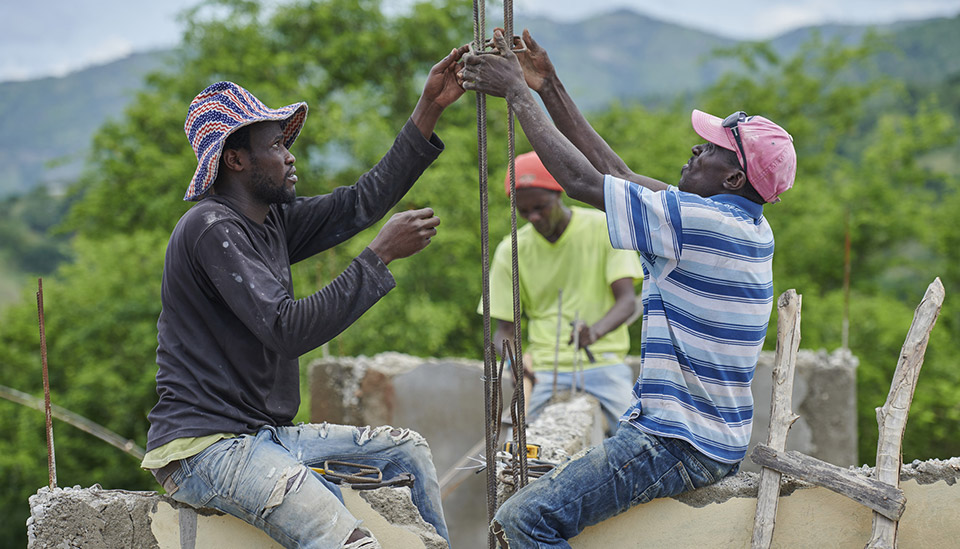 Workers in Haiti reconstructing an elementary school.